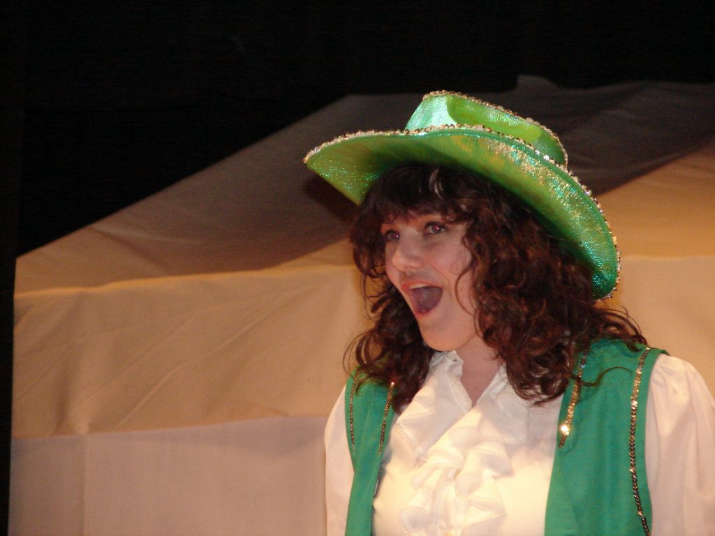 Random facts include a Highschool senior singing in Annie Get Your Gun wearing a green shiny cowgirl hat