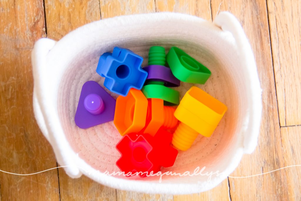 her brightly colored plastic jumbo nuts and bolts