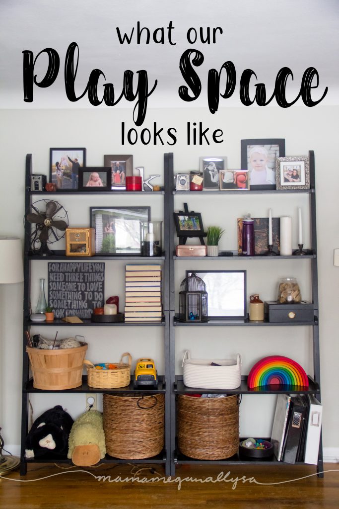 two tall bookshelves with the bottom two shelves for toddler toys for our living room play space