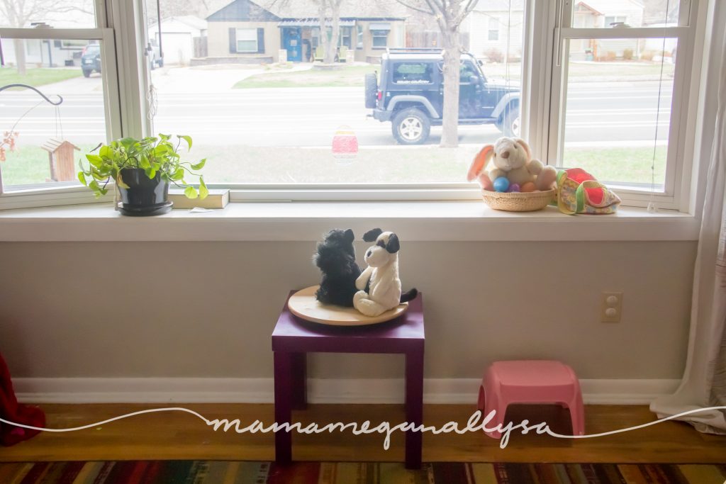 Our large window with her play table under it and her discovery tray on the ledge