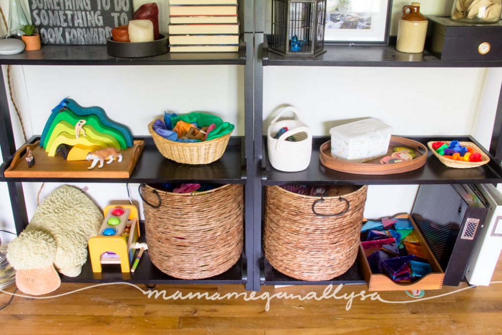 a closer look at the toy rotation with toddler toys displayed on her play shelves in trays and shallow baskets