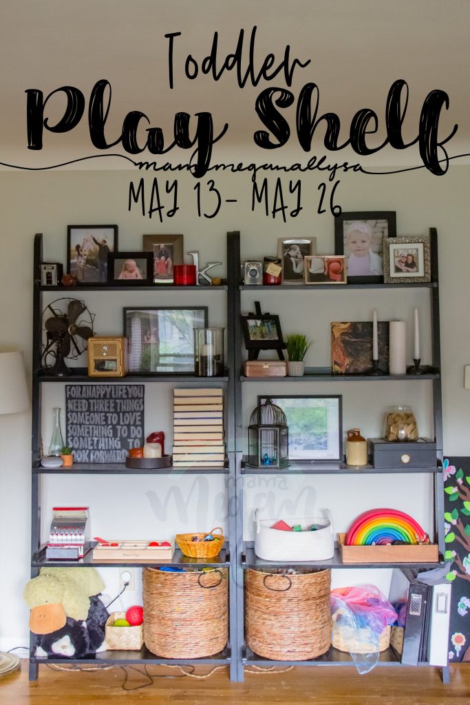 A title card for our play shelfie from mid may showing the livingroom bookshelves with toys on the bottom two shelves