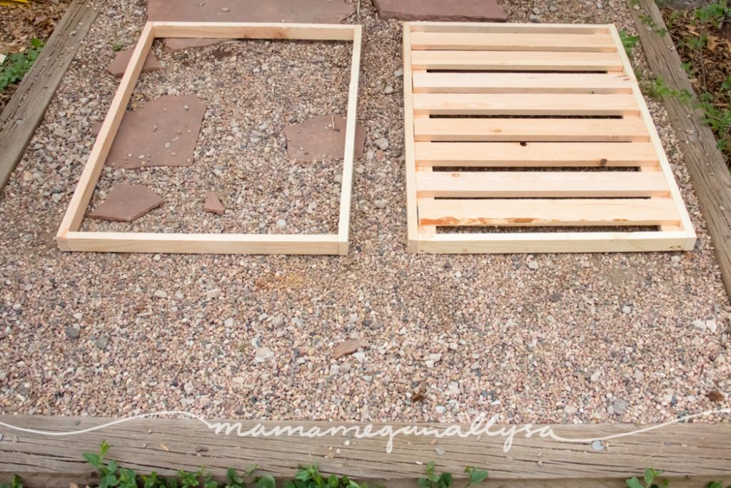 completed top frame and bottom shelf for the DIY sensory bin table laying on the ground