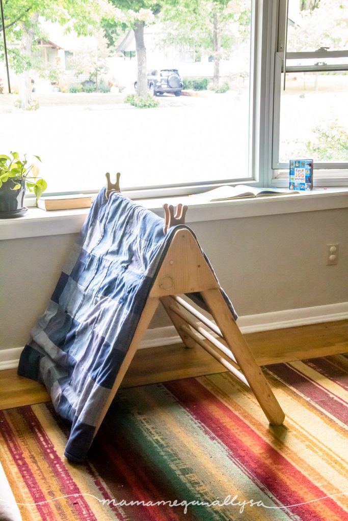 DIY wooden pickler turned into a tent in front of a large window