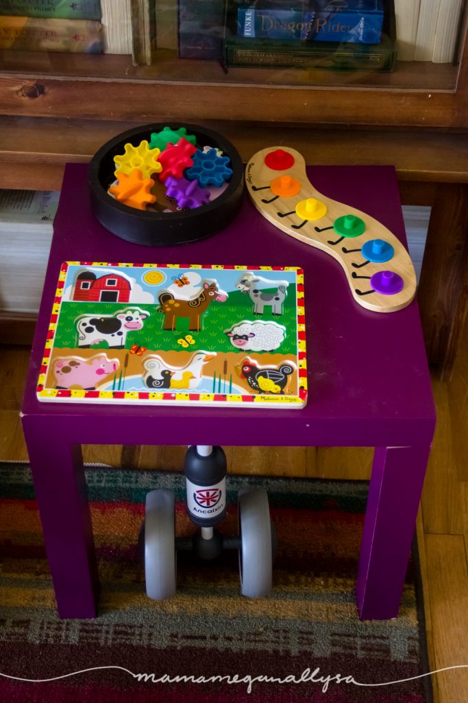 a small table with two puzzles on it in our play space
