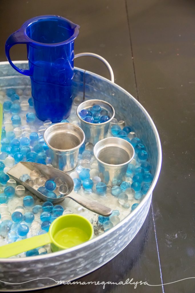 the cups and scoops for our water bead sensory play offered different sizes and shapes and sounds