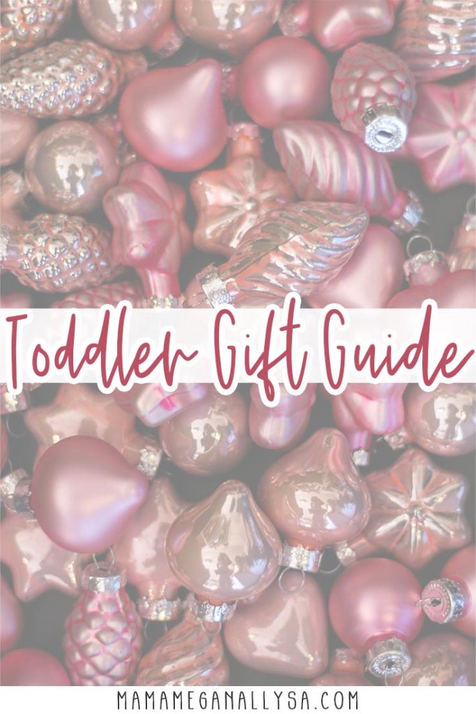 a pin image that reads toddler gift guide with a collection of pink baubbles and ornaments faded out in the background