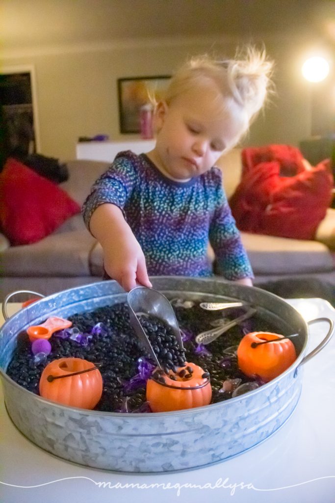 A candy jar scoop is our favorite sensory bin tool for scooping and pouring