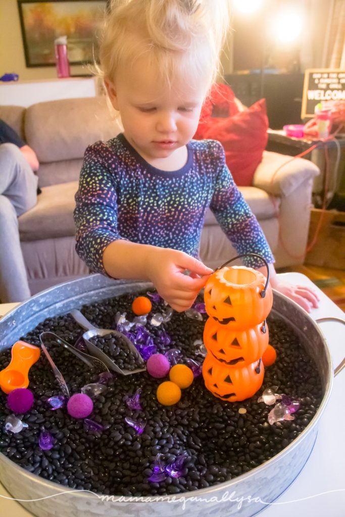 Holiday decorations and part favors make for great additions to our Halloween sensory bin.