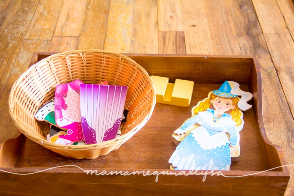 Magnetic dress up princess doll displayed on a tray