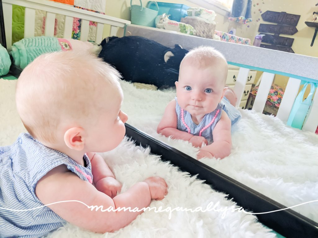 Mirrors are wonderful for newborn playtime! A newborn begins to recognize faces almost right away and loves to study their own face!