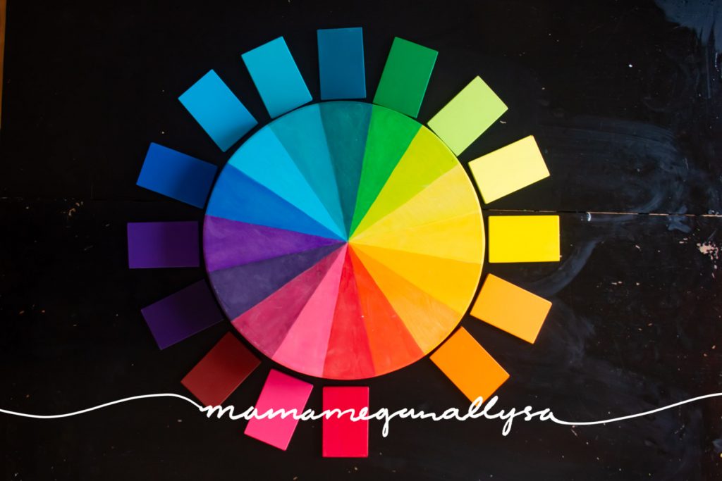 DIY wooden color wheel with color tablets laid around it to match up with the colors on the wheel