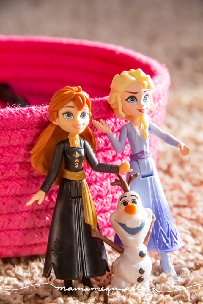 a close up shot of a small Anna, Elsa and Olaf figures from Frozen 2