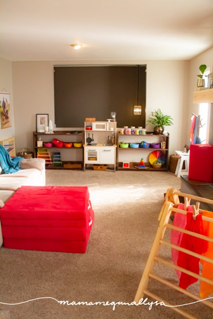 a overview shot of our rainbow toy rotation in our livingroom playroom