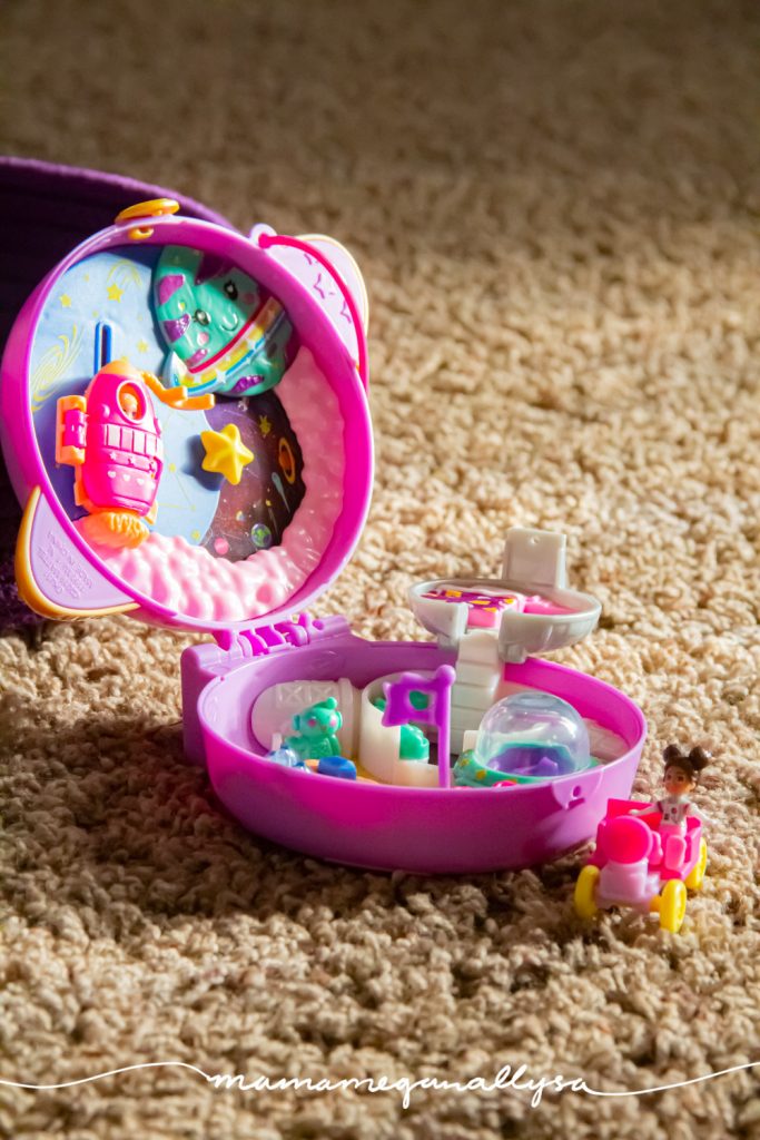 a close up of a space polly pocket compact