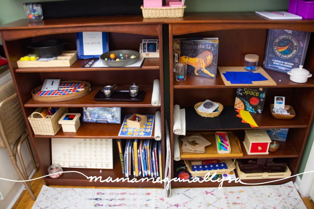 a look at our homeschool preschool work shelves with lots of space themed works on the shelf