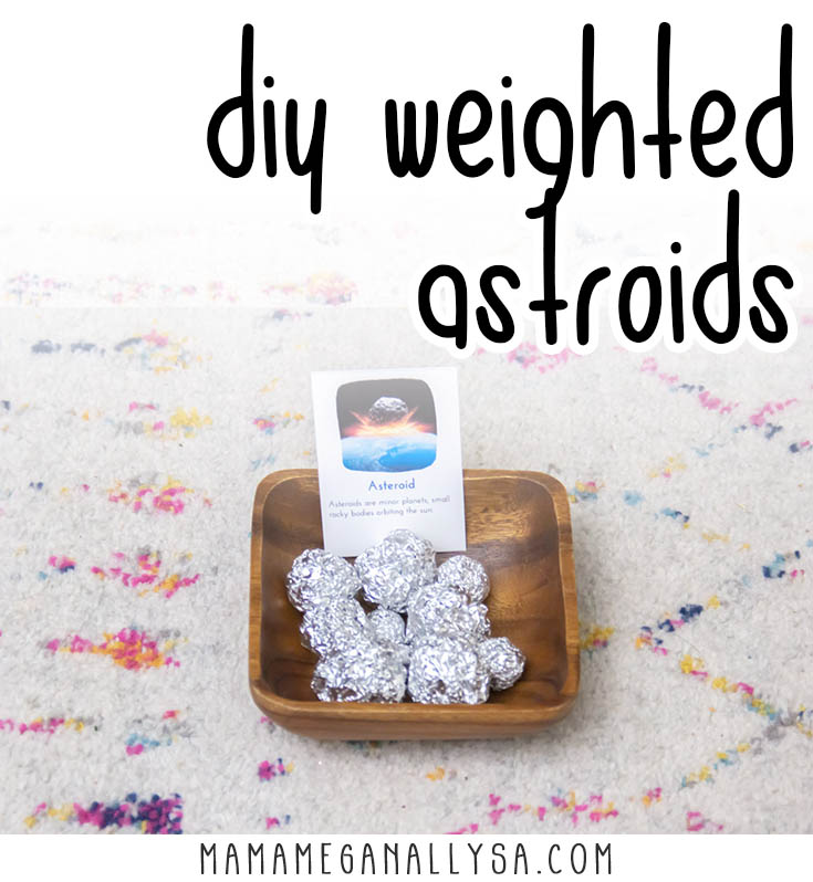 tinfoil "asteroids" in a wooden bowl with a info card