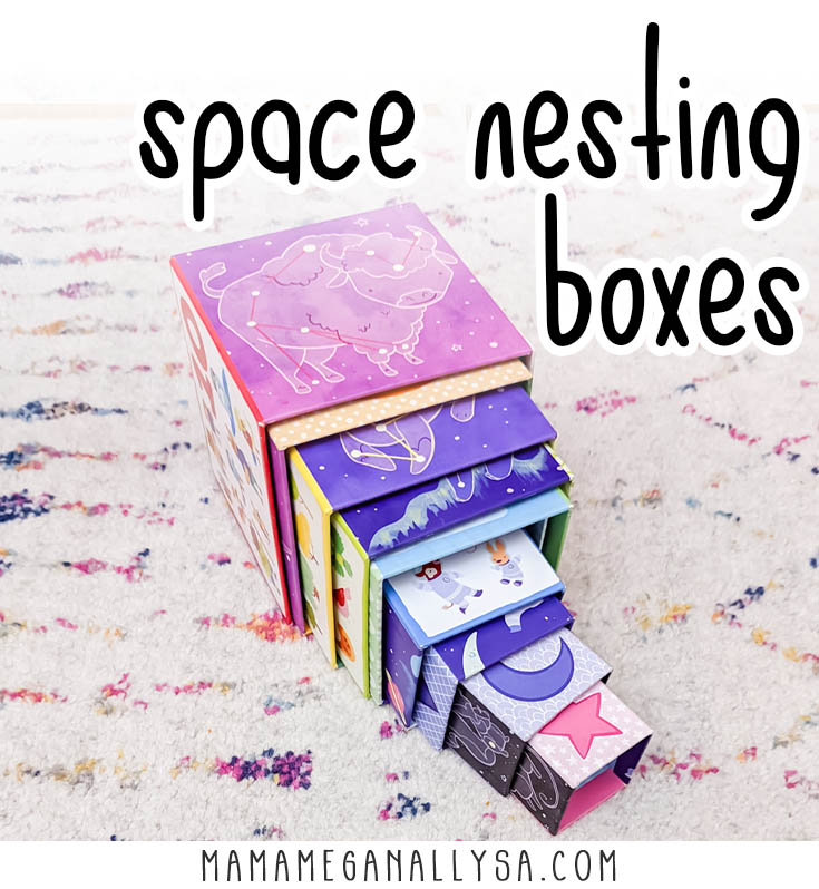 a set of cardboard nesting boxes that have a space theme all spilling out of the largest box