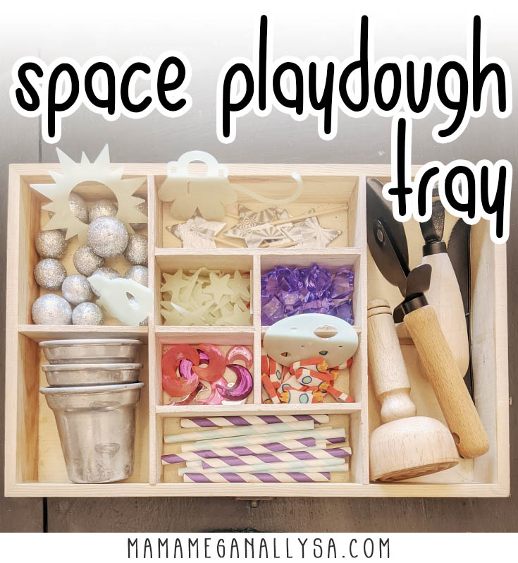 space playdough tray with lose parts like moon gems, rocket mini erasers, glow in the dark stars and more as well as some play dough tools in a wooden tray with various compartments