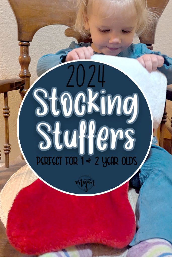 a pin image that reads 2024 stocking stuffers perfect for your 1 & 2 year olds with an image of a toddler looking into a red christmas stocking