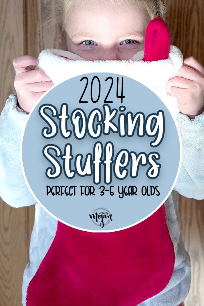 a pin image that reads 2024 stocking stuffers perfect for your 1 & 2 year olds with an image of a preschooler peeking over the top of a red christmas stocking