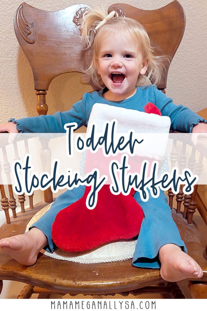 a pin image that reads toddler stocking stuffers with an image of a blonde toddler dressed in blue sitting in a wooden rocking chair with a red Christmas stocking in her lap