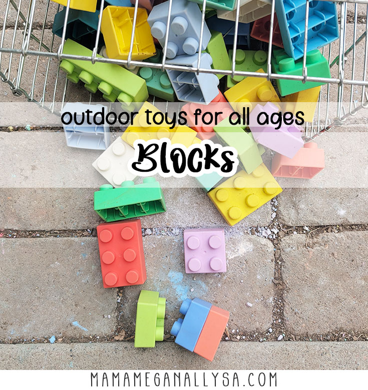 a pin image that reads outdoor toys for all ages blocks overlayed on an image that shows a wire basket tipped over spilling a collection of brightly colored silicon building blocks scattered on the patio pavers